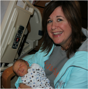 Picture of Cathy Mayer holding my baby at Madison Hospital.