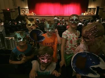 Picture of children in the audience at Huntsville High's production of Pinocchio.