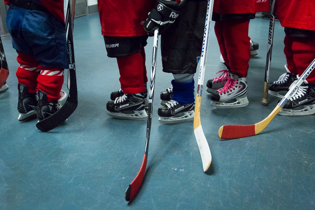 Picture of young hockey kids ice skates and sticks