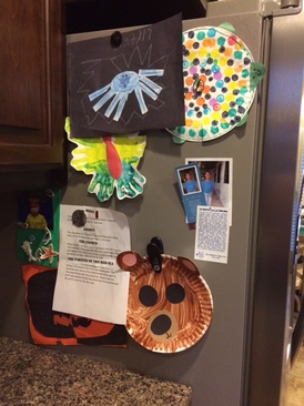 Picture of children's artwork on the refrigerator.